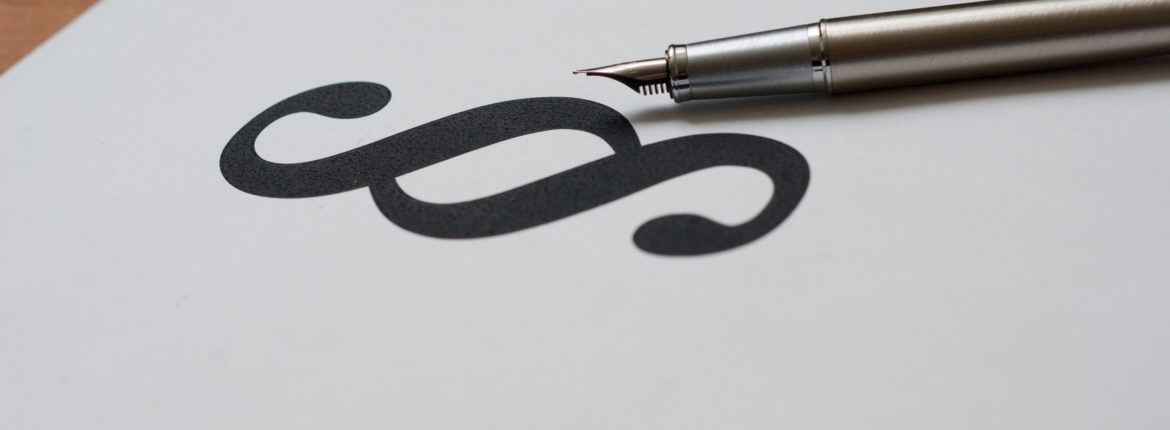 Pióro i znak paragrafu